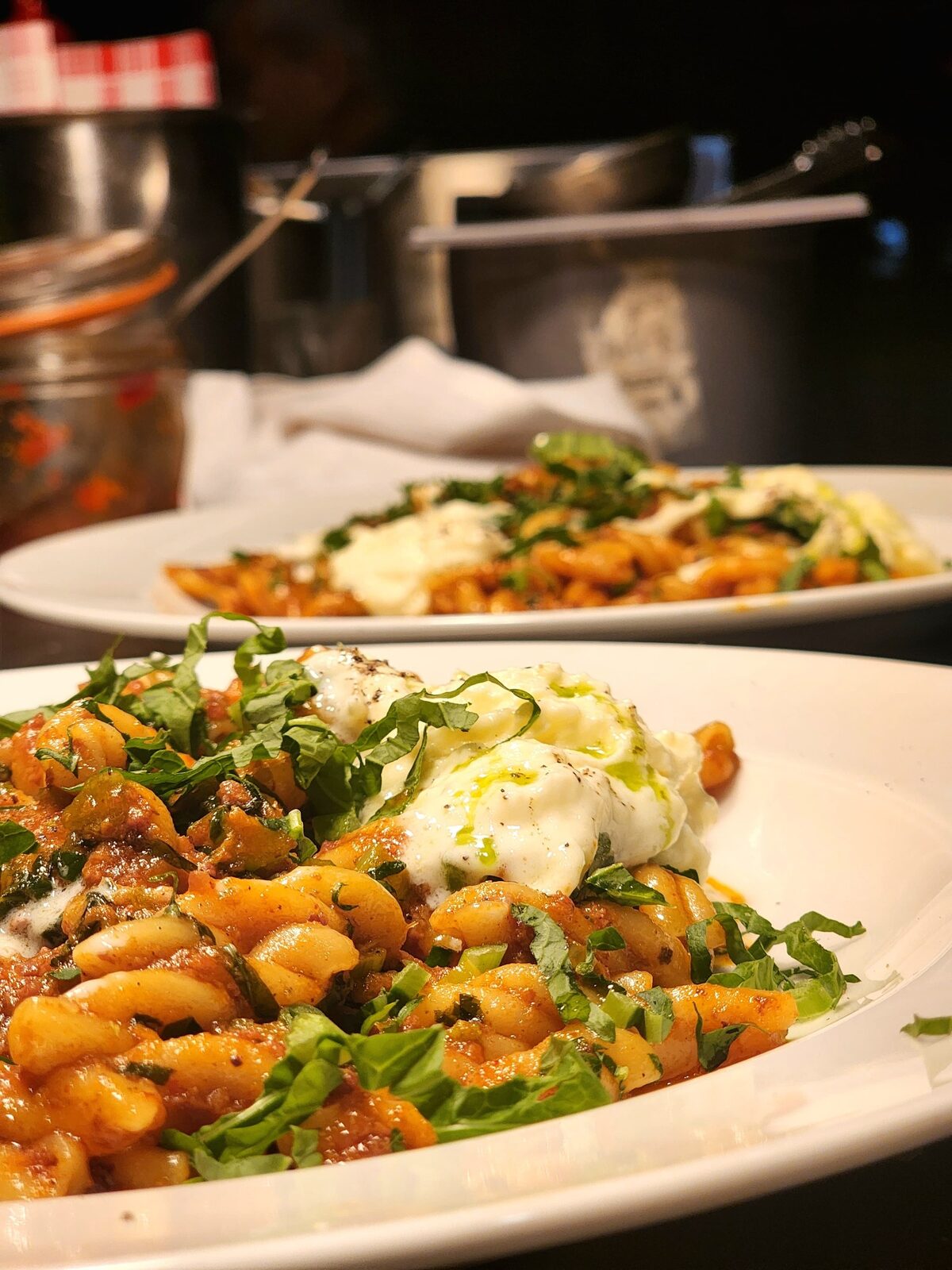Fresh pasta served with tomato, herbs and creamy cheese