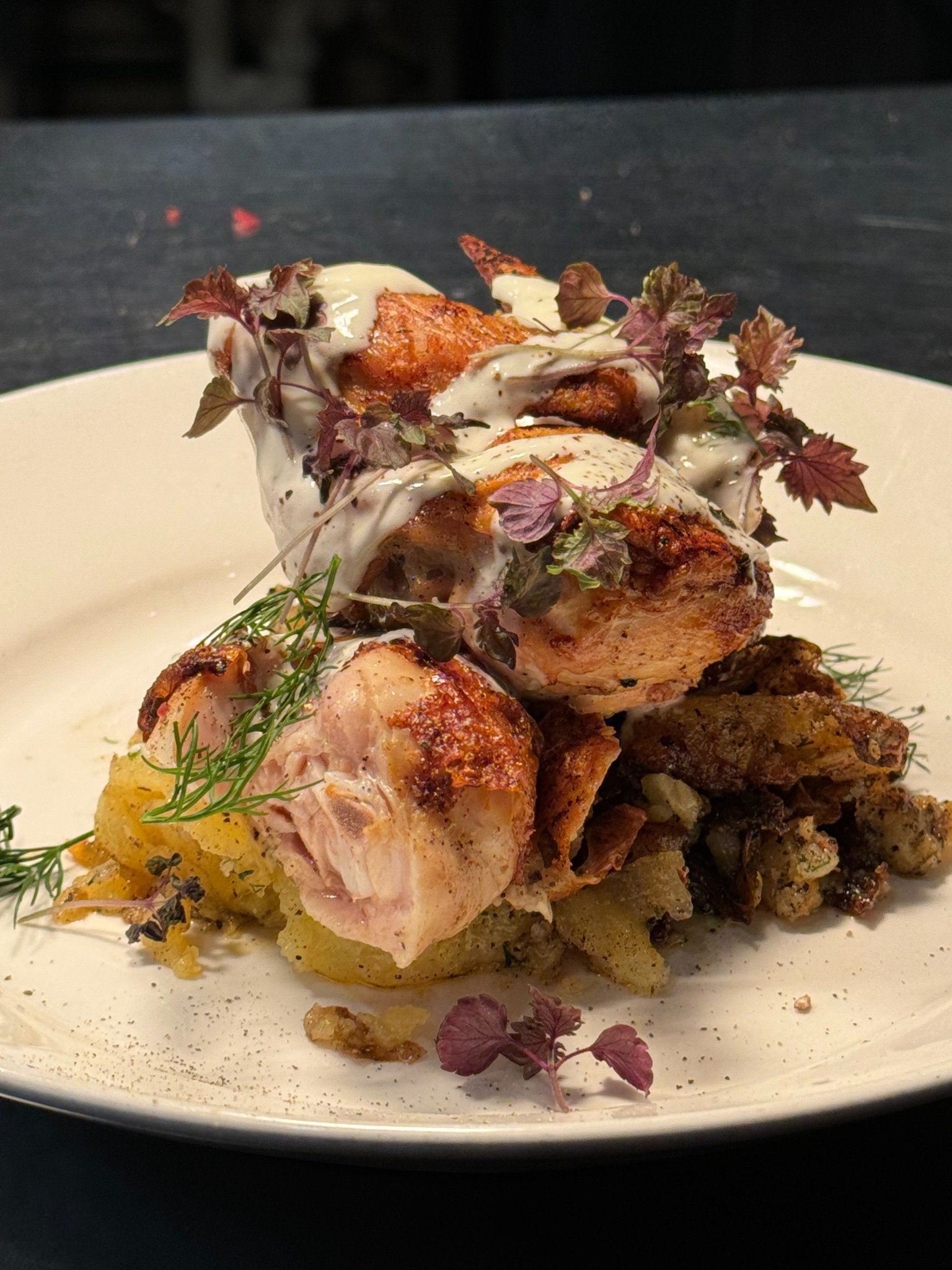 Roasted chicken with potatoes, herbs and sauce